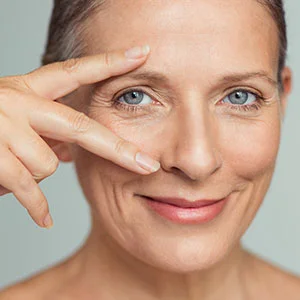 Woman receiving facial treatment