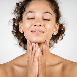 Woman receiving facial treatment