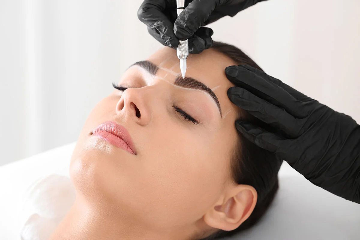 Woman receiving facial treatment