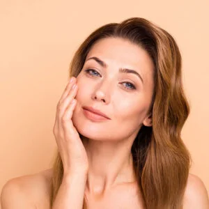 Woman receiving facial treatment