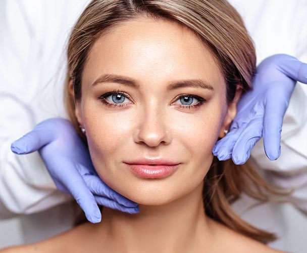 Woman receiving facial treatment