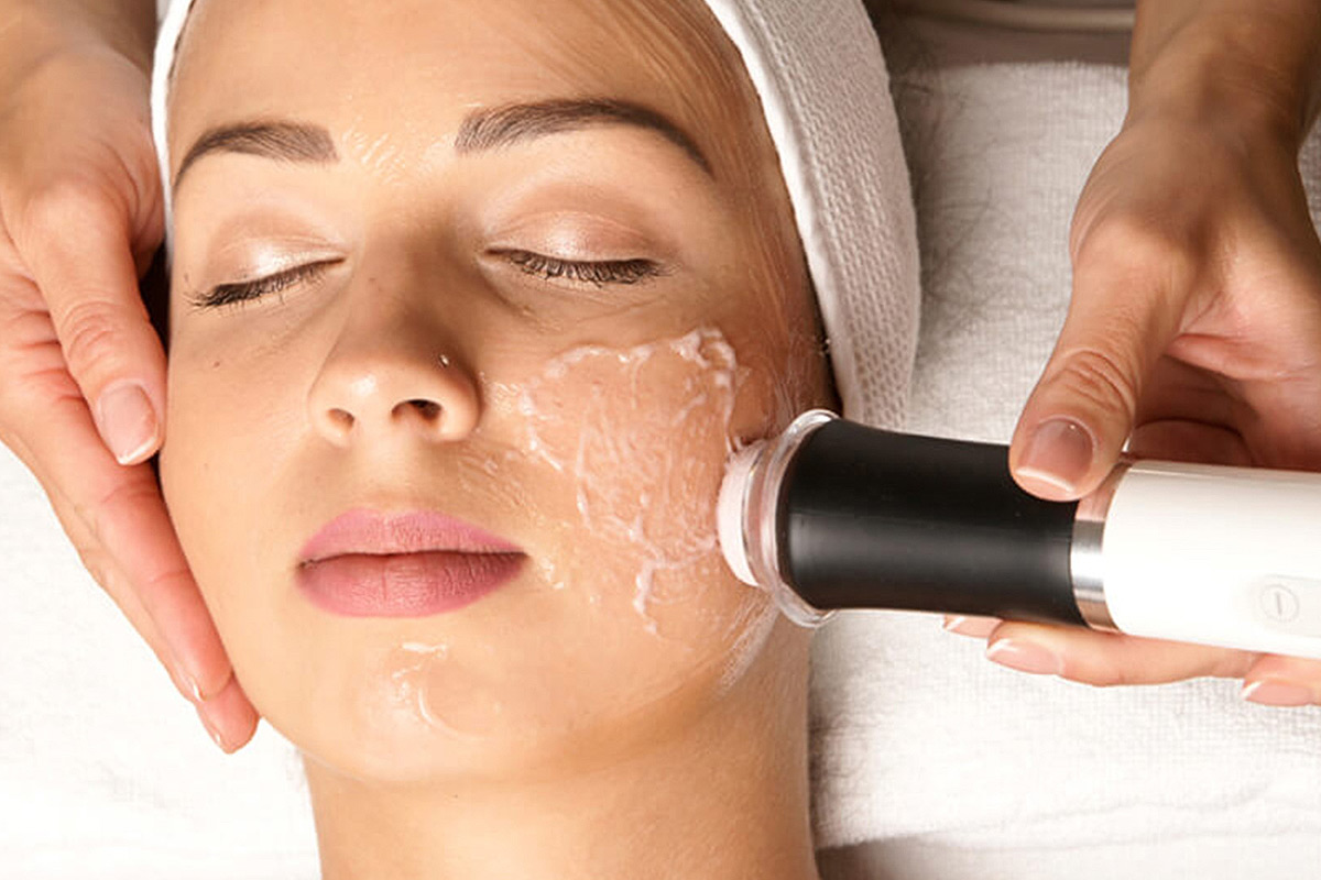 Woman receiving facial treatment