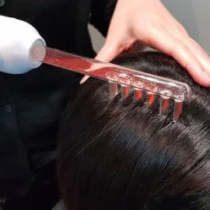 Woman receiving facial treatment