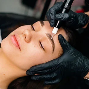 Woman receiving facial treatment