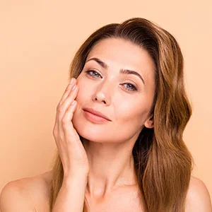 Woman receiving facial treatment
