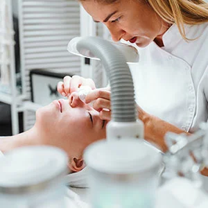 Woman receiving facial treatment