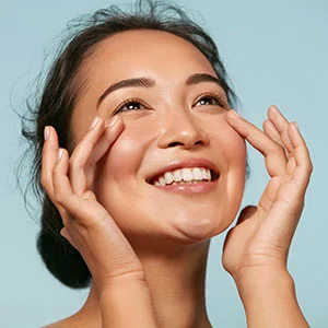 Woman receiving facial treatment