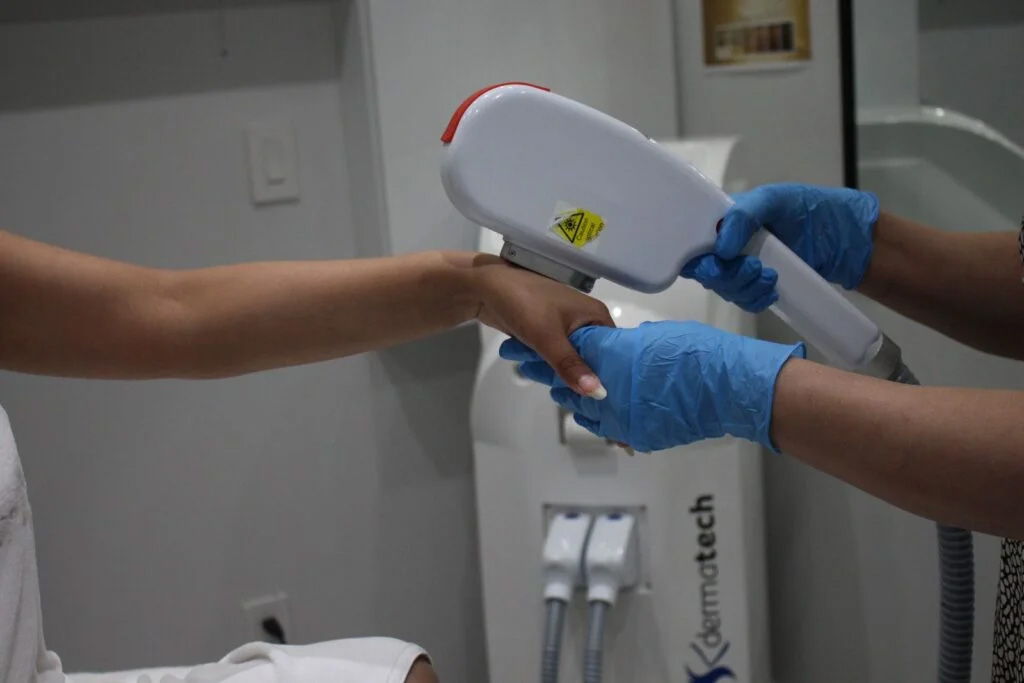 Woman receiving facial treatment
