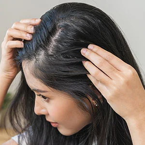 Woman receiving facial treatment