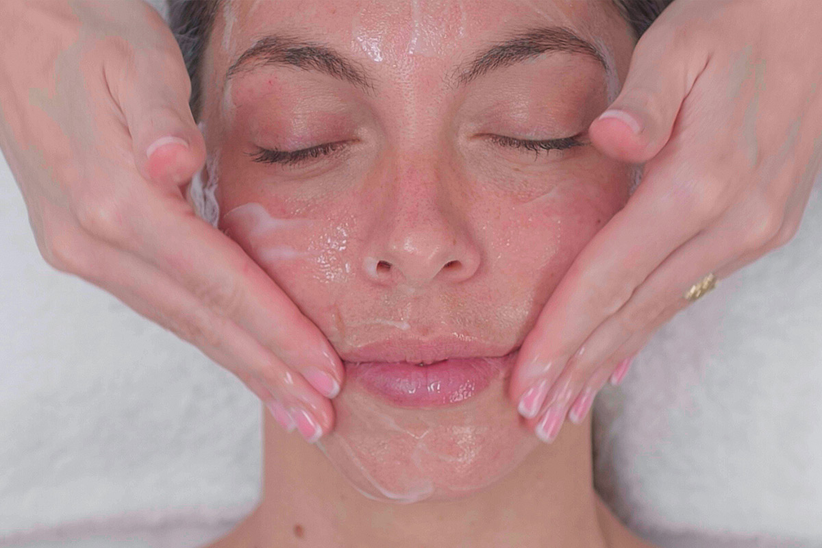 Woman receiving facial treatment